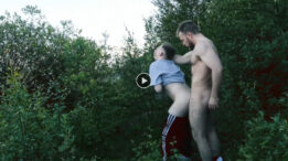 Muscle man plays with a young stud in a woods